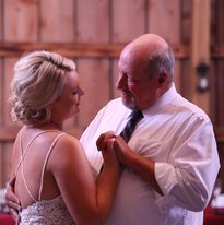 Lonnie Gerrie dancing with his daughter at her wedding
