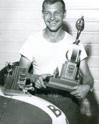 Bob Chaney hold a trophy