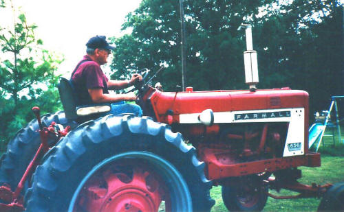 John just driving his tractor